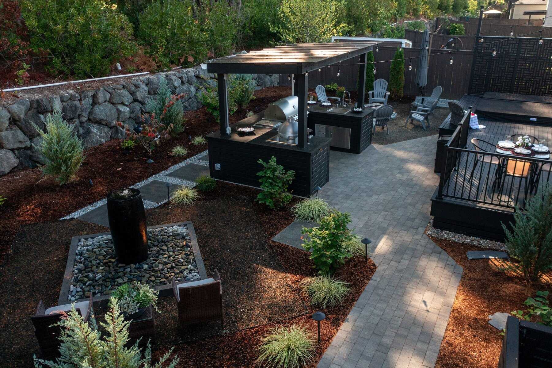 Mature plantings around a deck — Father Nature maintenance client
