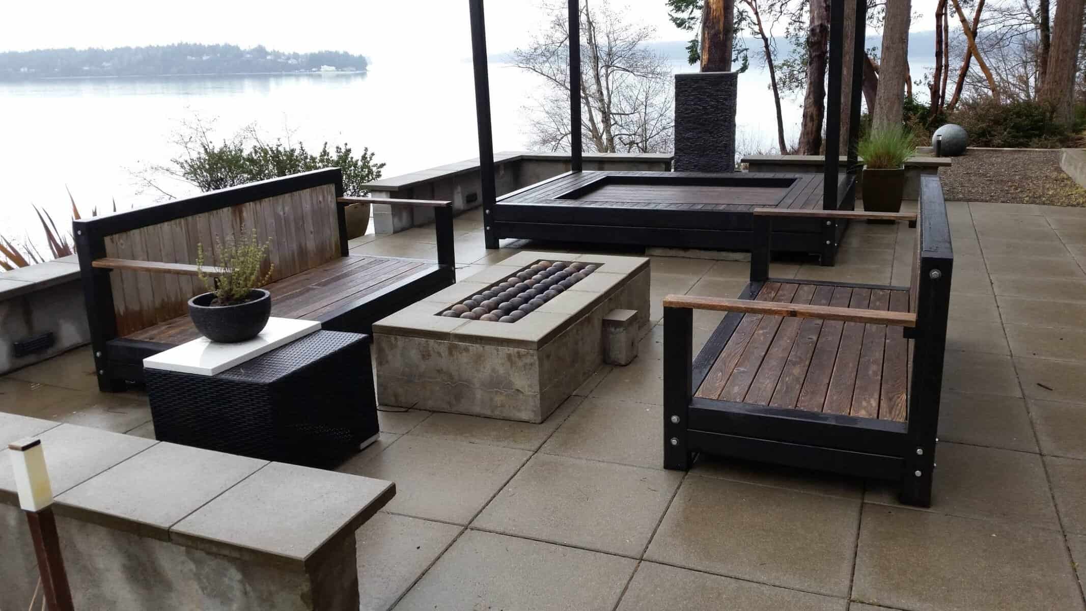 Board-formed concrete patio with outdoor kitchen and hot tub, Longbranch waterfront